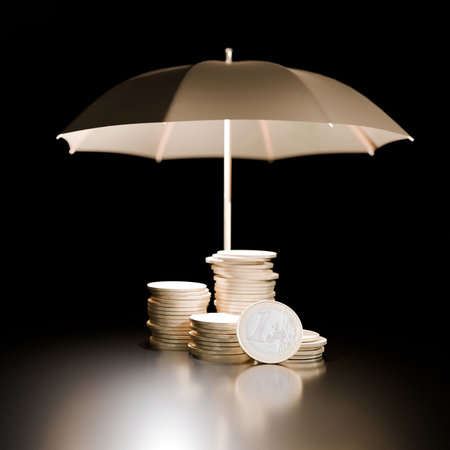 Stacks of euro coins protected by an umbrella on a dark background, symbolizing financial security, savings protection, investment safety, and economic stability concepts. Finance, creative ideaの写真素材