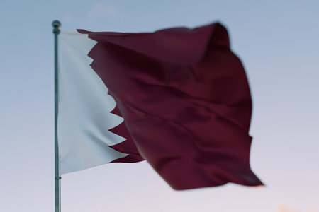 National flag of Qatar waving in the wind against a clear sky, symbolizing patriotism, independence, national pride, and unity.の写真素材