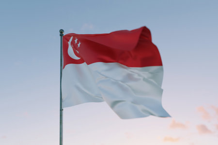 National flag of Singapore waving in the wind against a clear sky, symbolizing patriotism, independence, national pride, and unity.の写真素材