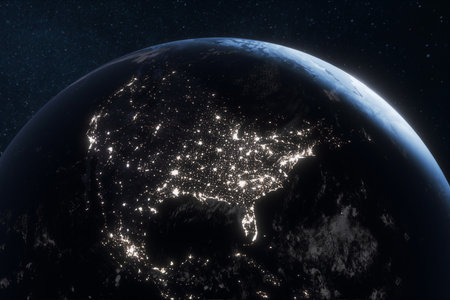 Earth from space at night showing North America illuminated by city lights, highlighting urban areas, human activity, and global connectivity against the dark expansion of the universe.の写真素材
