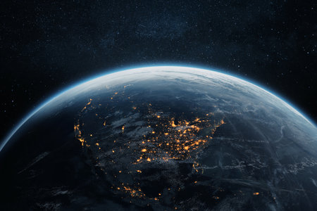 Night view of Earth from space, showing illuminated cities like New York, Washington, Atlanta, and Chicago. Stunning North America lights under a starry sky.の写真素材