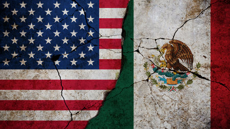 Conceptual image showing cracked flags of the United States and Mexico, symbolizing political tension, diplomatic conflict, or strained international relations between the two neighboring countries.の写真素材