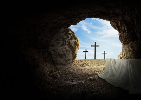 Easter and Good Friday concept, empty tomb with cross on mountain on a blue sky. Creative idea Easter. Religion and Christianity. Open empty cave. Free copy space for designの写真素材