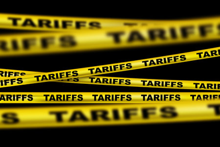 Yellow Tape Tariffs on Black Background. Economic Trade War. America Introduces Tariffs on Imports. Crisisの写真素材