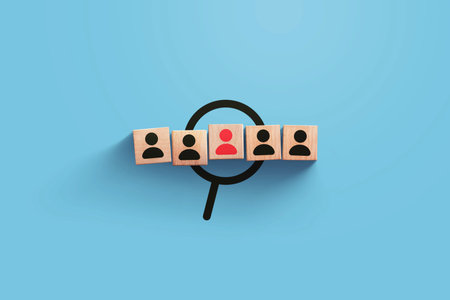 HR creative idea. Wooden cubes with staff and red leader person on blue background. Recruitment, business and team. Leadership, concept. Teamwork. Personnel searchの写真素材