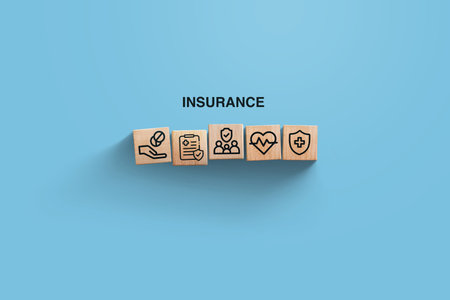 insurance, creative idea. Wooden blocks with icons of medical insurance on blue background, top view. Health and insurance, conceptの写真素材
