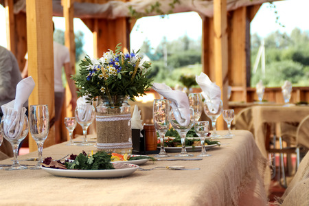 very nicely decorated wedding table with plates and serviettes. 07