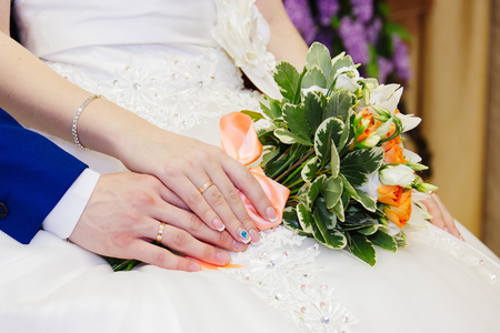 Detail of brides roses bouquet and hands holdingの写真素材