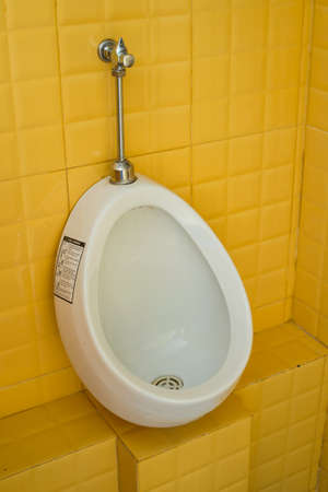 the urinal in the yellow rest roomの写真素材