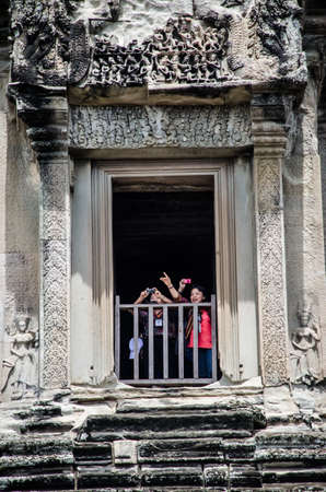 the traveller at window of the tower of Angkor wat, Cambodia- August, 24, 2013のeditorial素材