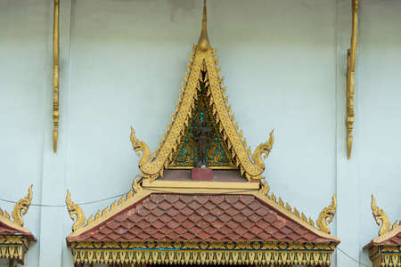 the beautiful Thai art roof over the window at Wat Sanpayang Luang, Lamphun, Thailand