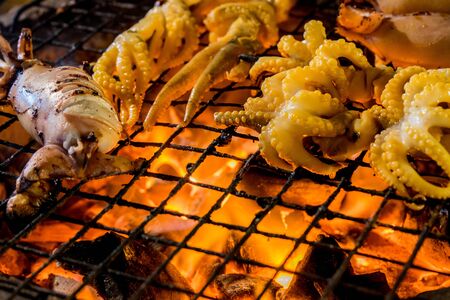 grilled squid on grate for grillの写真素材
