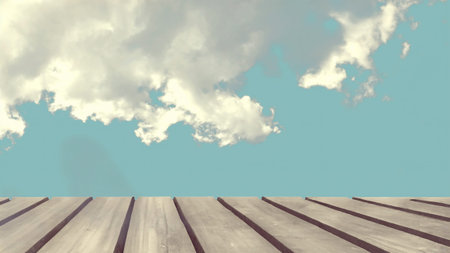 Wooden floor against blue sky with white clouds, 3d render