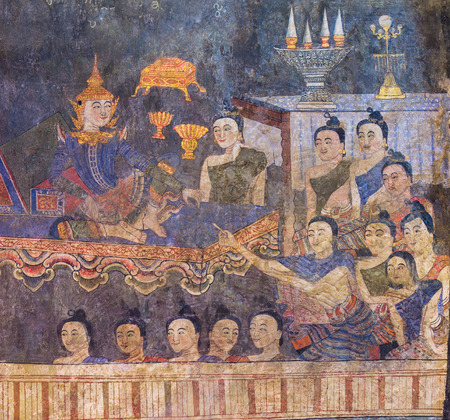 The famous mural painting of a man whispering to the ear of a woman on temple wall of Wat Phumin temple in Nan, Thailand.General in Thailand, any kind of art decorated in Buddhist temple created with money donated by people to hire artist. They are publicの写真素材
