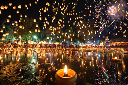 Thousands of Floating Lanterns, People and Fireworks in Yee Peng or Loy Krathong festival at Nong Bua, San Kampheng, Chiang Mai, Thailandのeditorial素材
