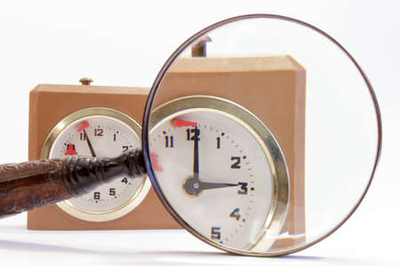 Dial of chess clock seen through a magnifying glassの写真素材