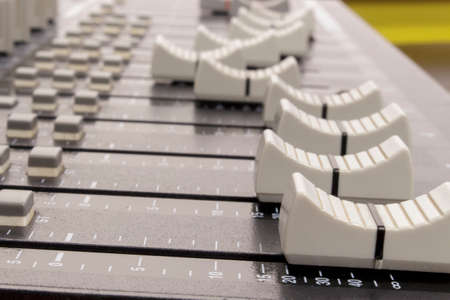 Lateral view of audio mixing board slidersの写真素材