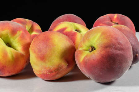Several peaches on clear and rough surface and black backgroundの写真素材