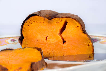 Roasted sweet potato in ceramic trayの写真素材