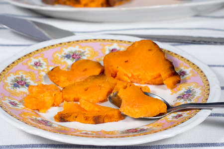 Eating roasted sweet potatoの写真素材