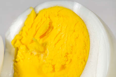Close-up view of yolk of a hard-boiled egg cut in halfの写真素材