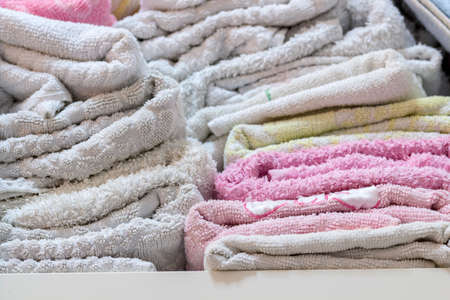 Close-up of towels in bathroom shelfの写真素材