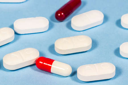 Generic pills of clavulanic acid beside other tablets and capsules. Antibioticsの写真素材