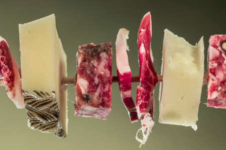 Different spanish foods: Iberian ham, Iberian salchichón and Manchego Curado cheeseの写真素材