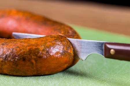 Knife cuts a traditional homemade blood sausageの写真素材