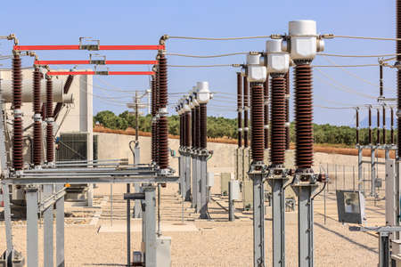 Disconnect switches, lightning arresters and other elements in the electrical substation of a wind...
