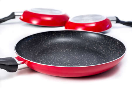 Induction frying pans made of aluminium with marble coating. On white.の写真素材