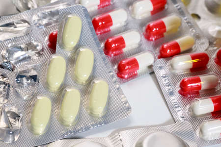 Outdated bundles of pills and capsules