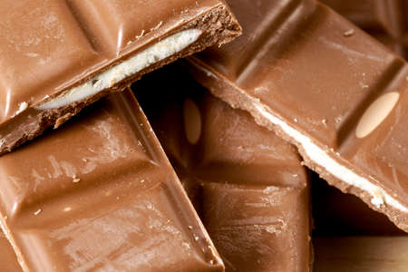 Close-up of heap of filled chocolate tabletsの写真素材