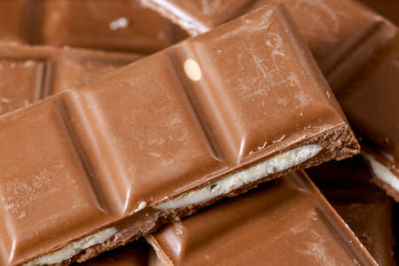 Close-up of heap of filled chocolate bars. Food backgroundの写真素材