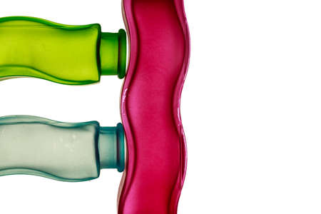Primary colors design. Red, green and blue decorative glass jars with sinuous shape, with blank space at right of the image . White backgroundの写真素材