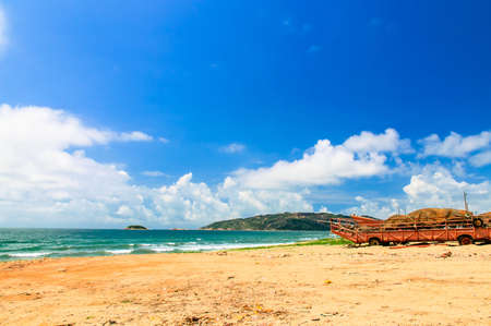Waves coming from the sea, hitting the beachの写真素材
