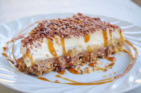 Delicious slice of a banoffee pie with caramel syrupの写真素材