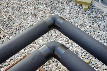 Pipes insulated with closed cell foam insulationの写真素材