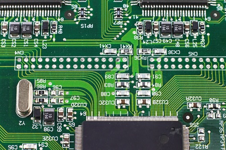 Digital hardware closeup. Microchips assembly on the circuit board macro