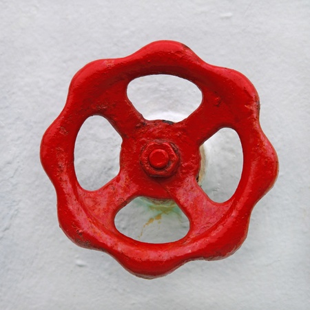 Fire hydrant valve on rough white surface