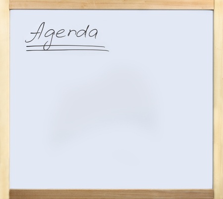 Word agenda written on whiteboard in wooden frameの写真素材