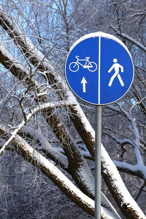 Blue road sign on the winter natural backgroundの写真素材