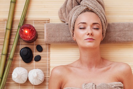 beautiful young woman at spa sessionの写真素材