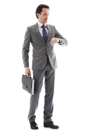 Full body portrait of young business man with briefcase isolated on whiteの写真素材