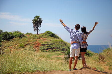 Young couple enjoy beautiful sea view on vacationの写真素材