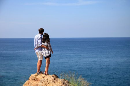 Young couple enjoy beautiful sea view on vacationの写真素材