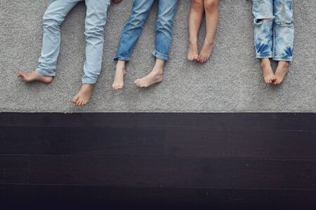 Group of kids laying on floor, top viewの写真素材