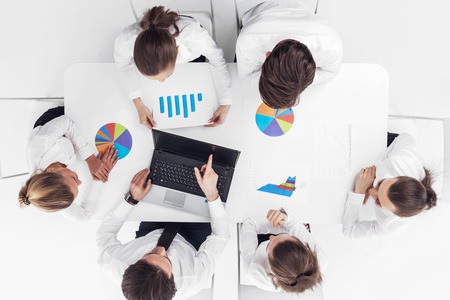 Top view of business people working with financial reportsの写真素材