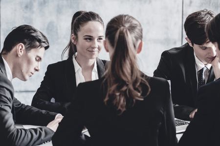 Group of business people working together at meeting in office