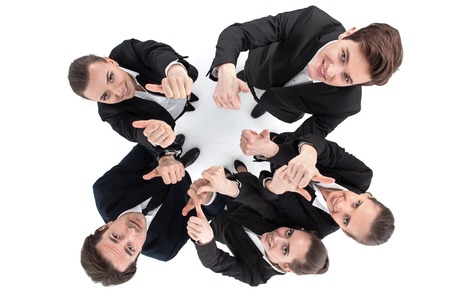 Successful young business people showing thumbs up sign isolated on white background